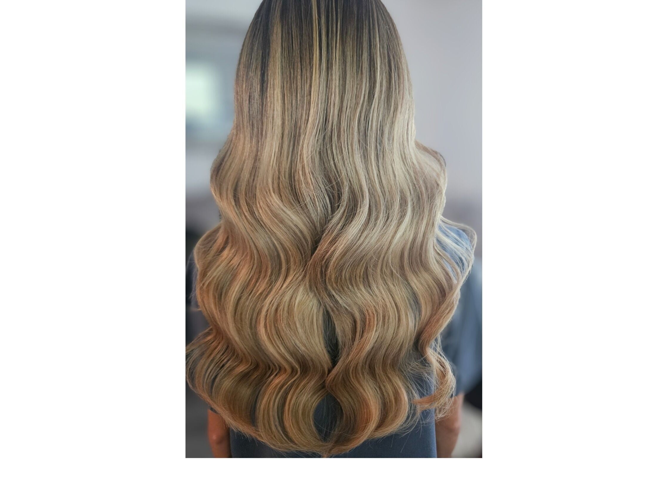 Elegant wavy blonde hair styled at Hair by Hayley P, Liverpool, England, GB.