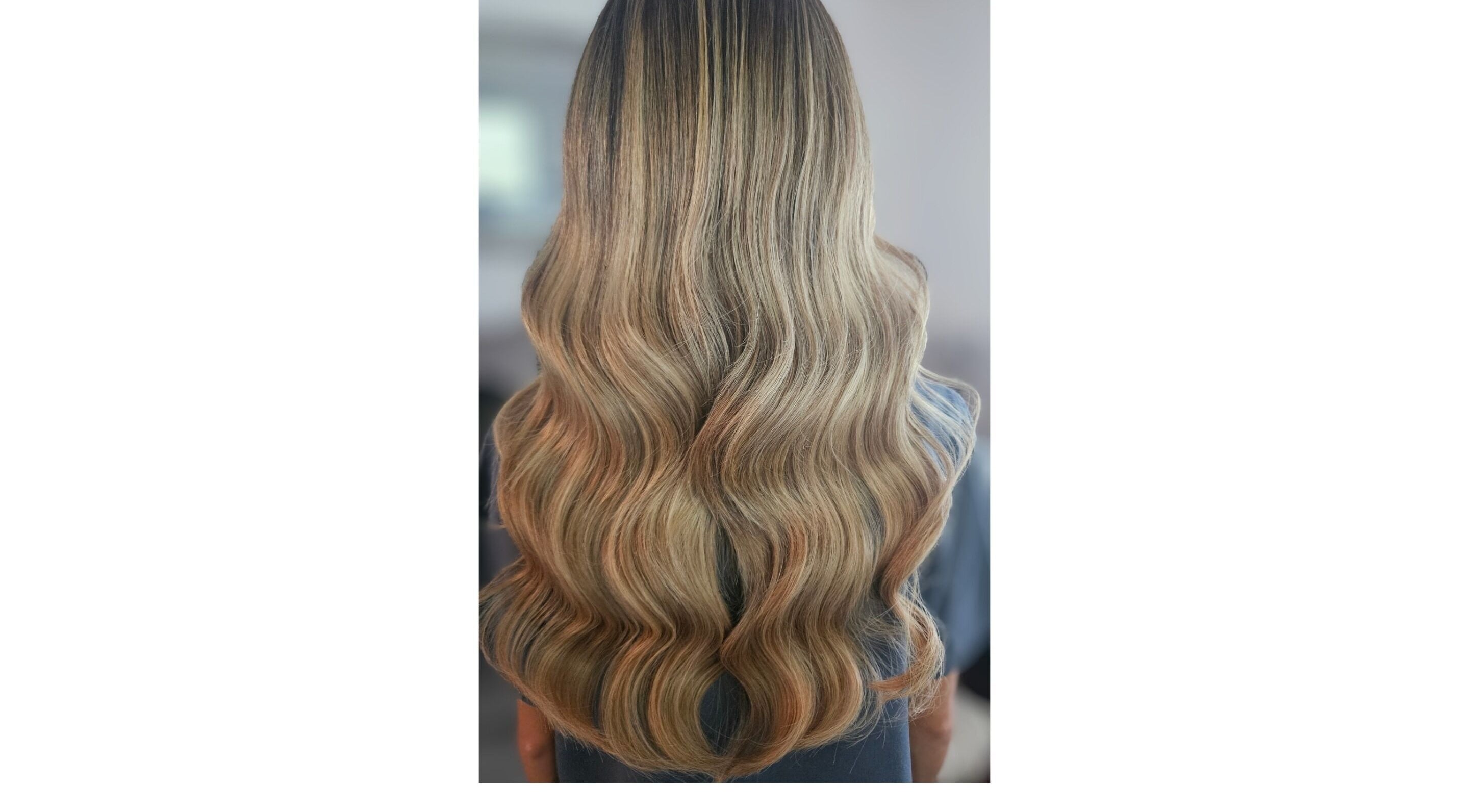 Elegant wavy blonde hair styled at Hair by Hayley P, Liverpool, England, GB.