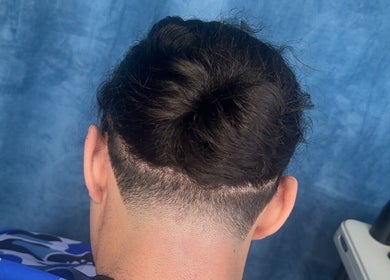 Freshly styled hair with a sleek taper at Zacky Cuts, Melbourne, Victoria, AU.