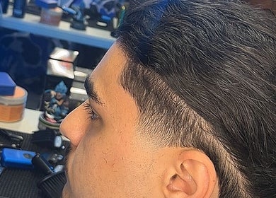 Close-up of a precise haircut at Zacky Cuts in Melbourne, Victoria, AU. Modern grooming tools visible.