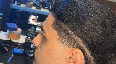Close-up of a precise haircut at Zacky Cuts in Melbourne, Victoria, AU. Modern grooming tools visible.