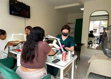 Stylish manicure session at TONALLI SALON, Guadalajara, Jalisco, MX. Clients enjoying professional nail care.