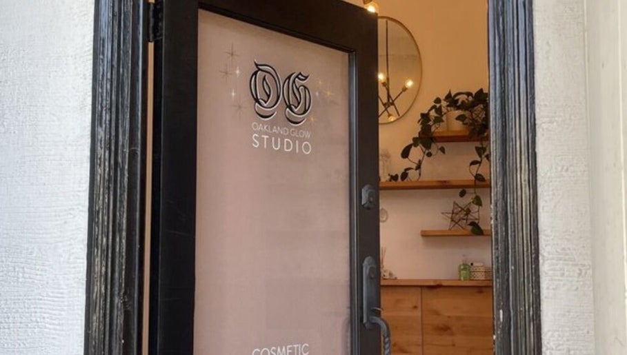 View of Oakland Glow Studio entrance in Oakland, California, US with sleek decor and greenery.