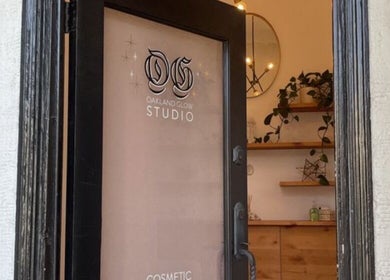 View of Oakland Glow Studio entrance in Oakland, California, US with sleek decor and greenery.