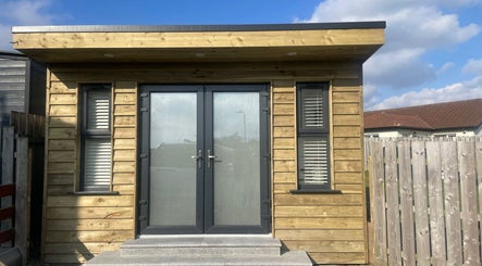 Modern wooden facade at Glow By Olivia, Warrenpoint, Northern Ireland, GB, offers a warm welcome.
