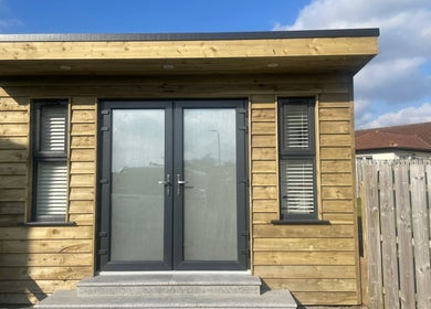 Modern wooden exterior of Glow By Olivia, Warrenpoint, Northern Ireland, GB under a clear sky.