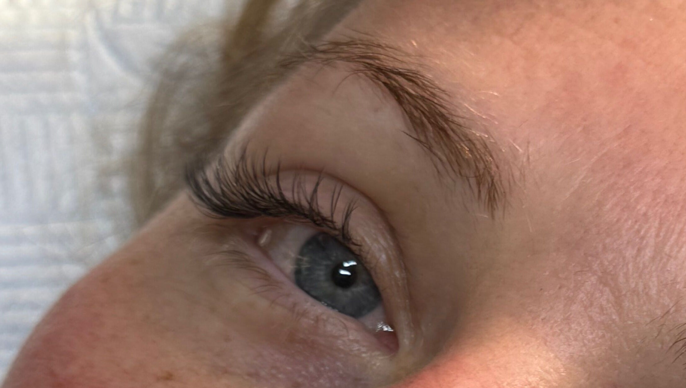 Close-up of a styled eyelash at LashandBe in London, England, GB, highlighting beauty services.