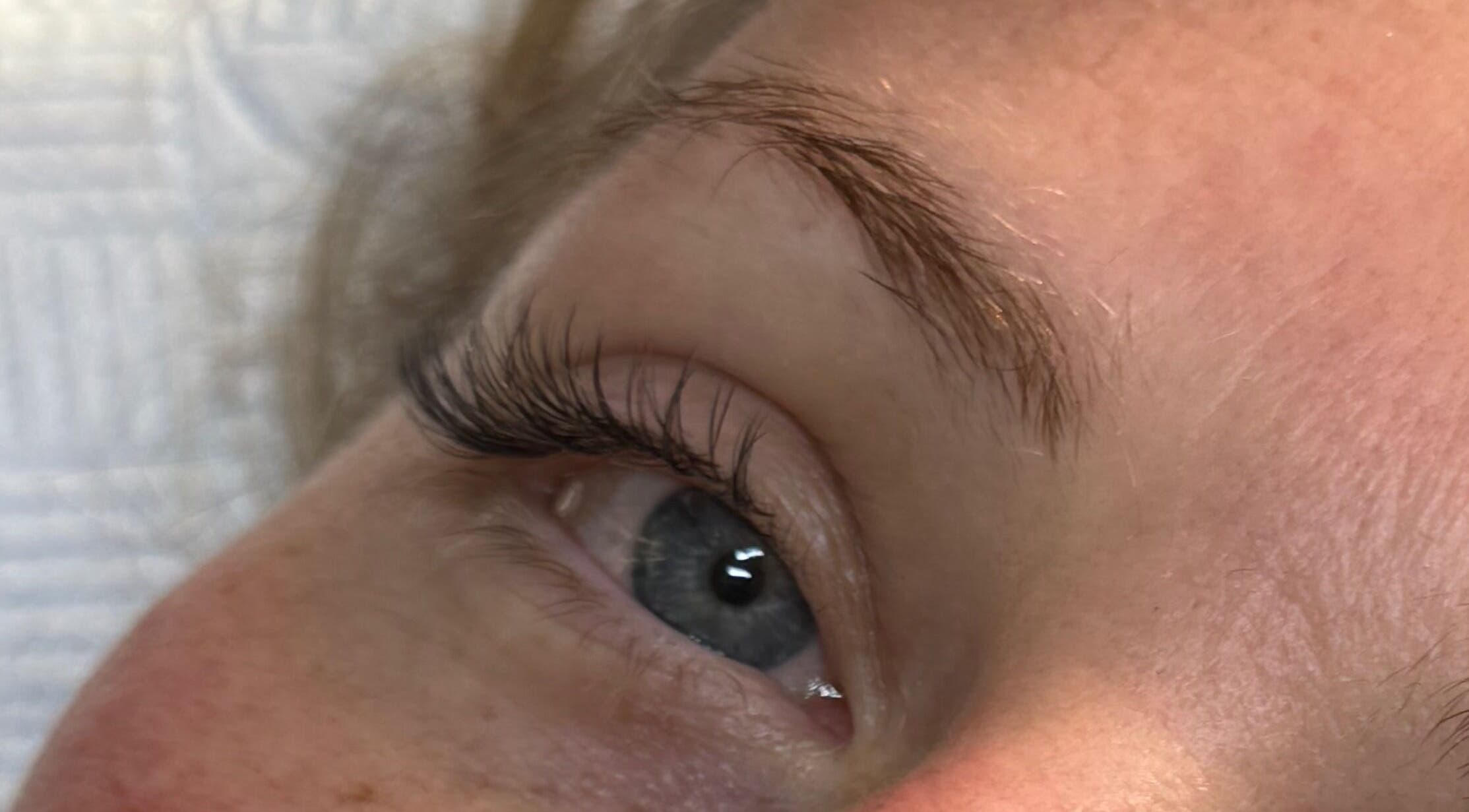 Close-up of a styled eyelash at LashandBe in London, England, GB, highlighting beauty services.