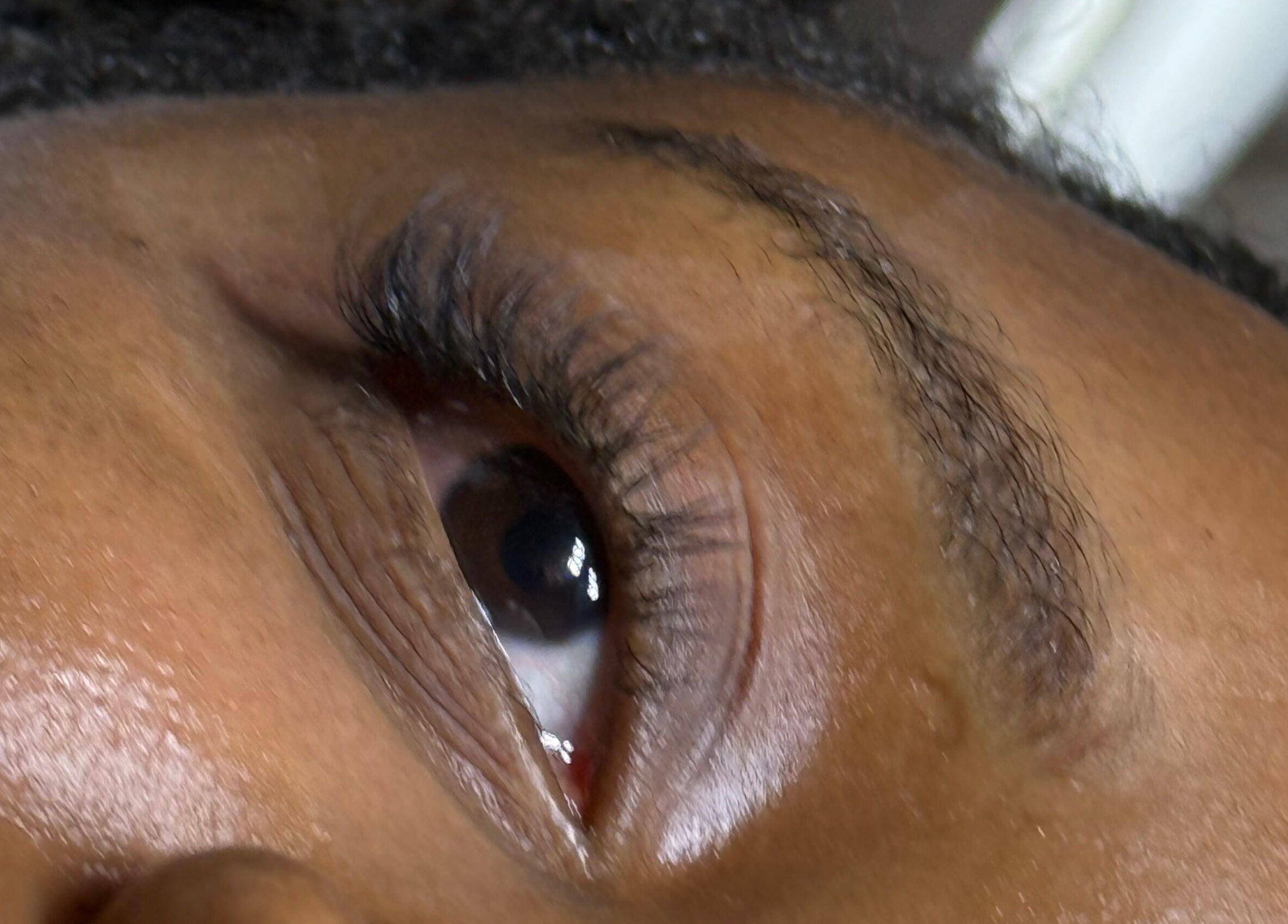 Close-up of eye showcasing elegant lash extensions at LashandBe, London, England, GB.