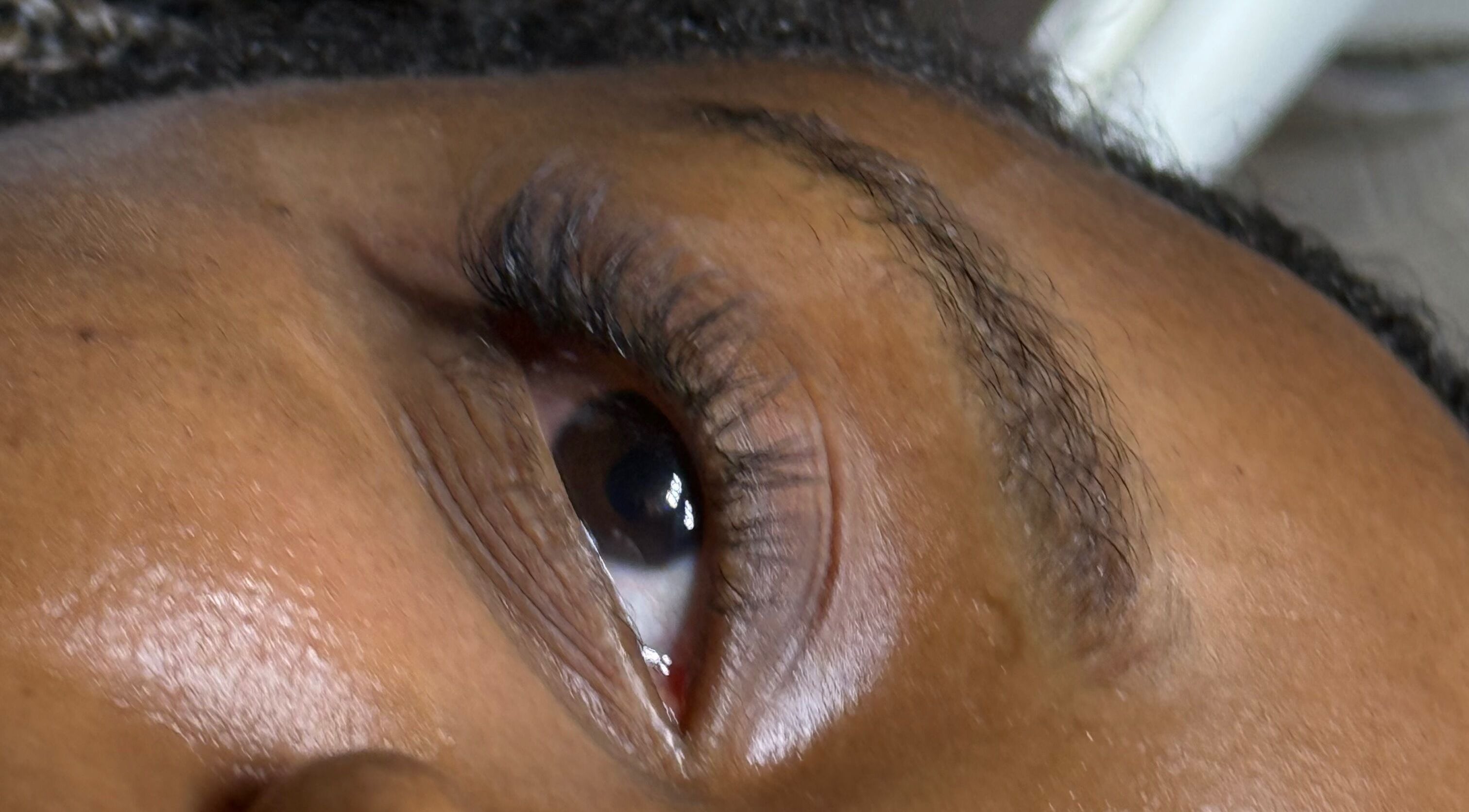 Close-up of eye showcasing elegant lash extensions at LashandBe, London, England, GB.