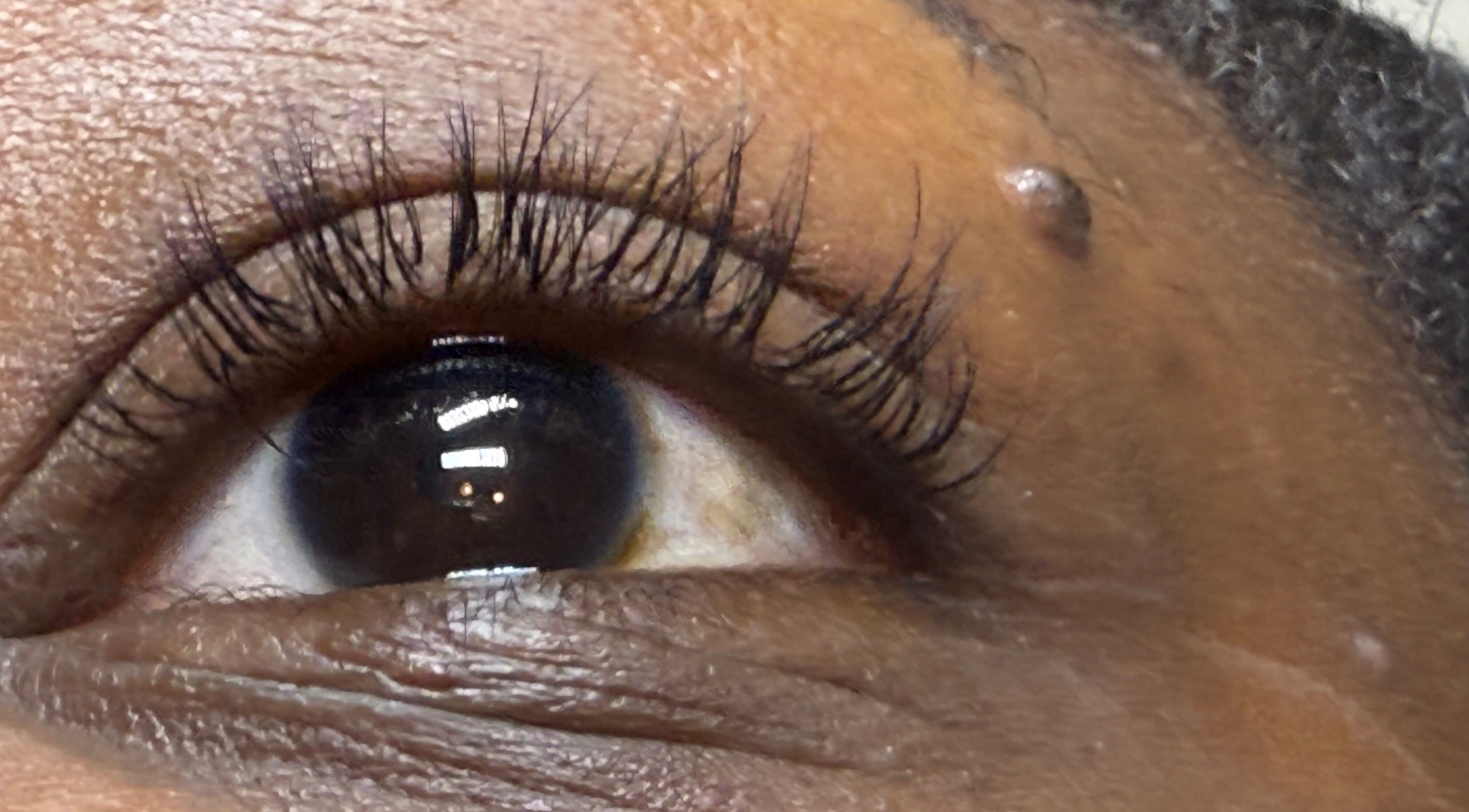 Closeup of elegant eyelashes at LashandBe, London, England, GB, showcasing beauty services.