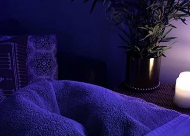 Relaxing spa setup with candle and plants at She’s Magnetic, Milton Keynes, England, GB.