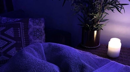 Relaxing spa setup with candle and plants at She’s Magnetic, Milton Keynes, England, GB.