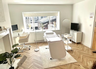 Bright, stylish treatment room at Skin and Snatch Studio, Liverpool, England, GB, featuring modern decor.
