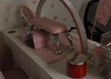 Nail station at Kait Beauty in Downey, California, US with pink decor and manicure tools.