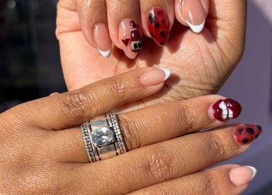 Stylish nail art by Traveling Nail Babe, Cape Town, Western Cape, ZA. Features ladybug design and elegant manicure.
