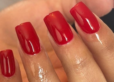 Vibrant red manicure by Traveling Nail Babe in Cape Town, Western Cape, ZA. Perfectly polished for style.
