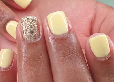 Yellow nails with gold glitter accents by Traveling Nail Babe in Cape Town, Western Cape, ZA.