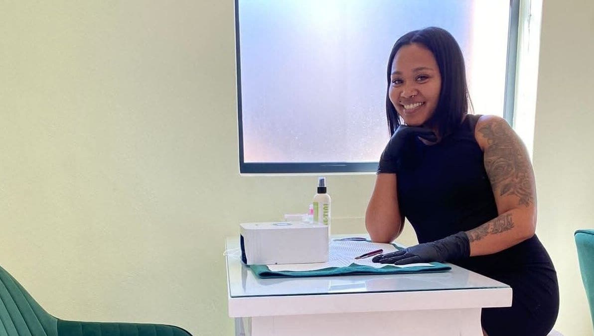 Gizzelle B staff welcoming clients in Cape Town, Western Cape, ZA for beauty services with a friendly smile.