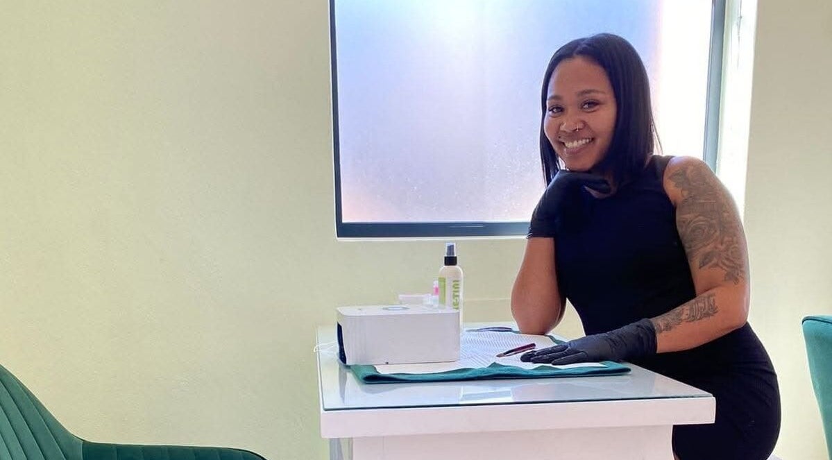 Gizzelle B staff welcoming clients in Cape Town, Western Cape, ZA for beauty services with a friendly smile.