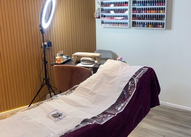 Relaxing salon setup at Anaya beauty, Inverness, Scotland, GB with manicure station and nail polish display.
