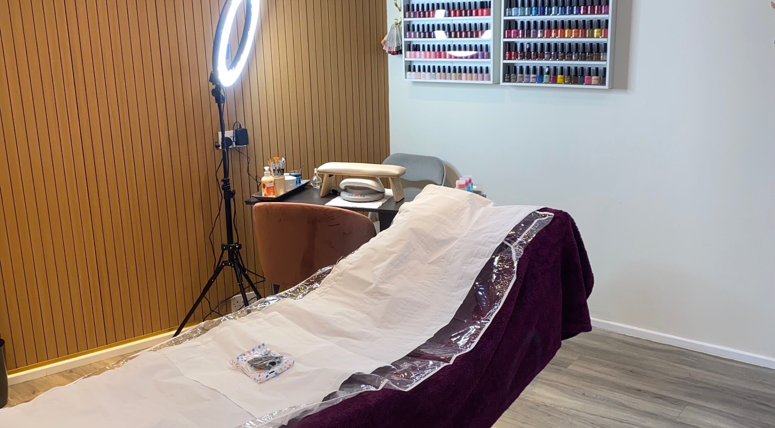 Relaxing salon setup at Anaya beauty, Inverness, Scotland, GB with manicure station and nail polish display.