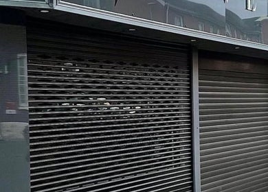 Exterior view of Beauty by Chloe in Strabane, Northern Ireland, GB, featuring sleek metal shutters.