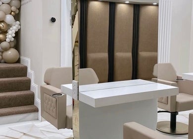 Modern salon interior at Beauty by Chloe in Strabane, Northern Ireland, GB with chic beige decor and seating.
