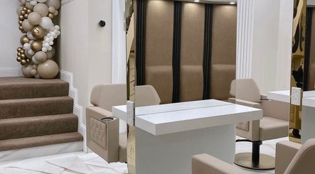 Modern salon interior at Beauty by Chloe in Strabane, Northern Ireland, GB with chic beige decor and seating.
