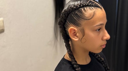 Sophisticated braid hairstyle at Shariiey'sfabulousbraidscw, Willemstad, Curaçao, CW. Perfectly styled hair.