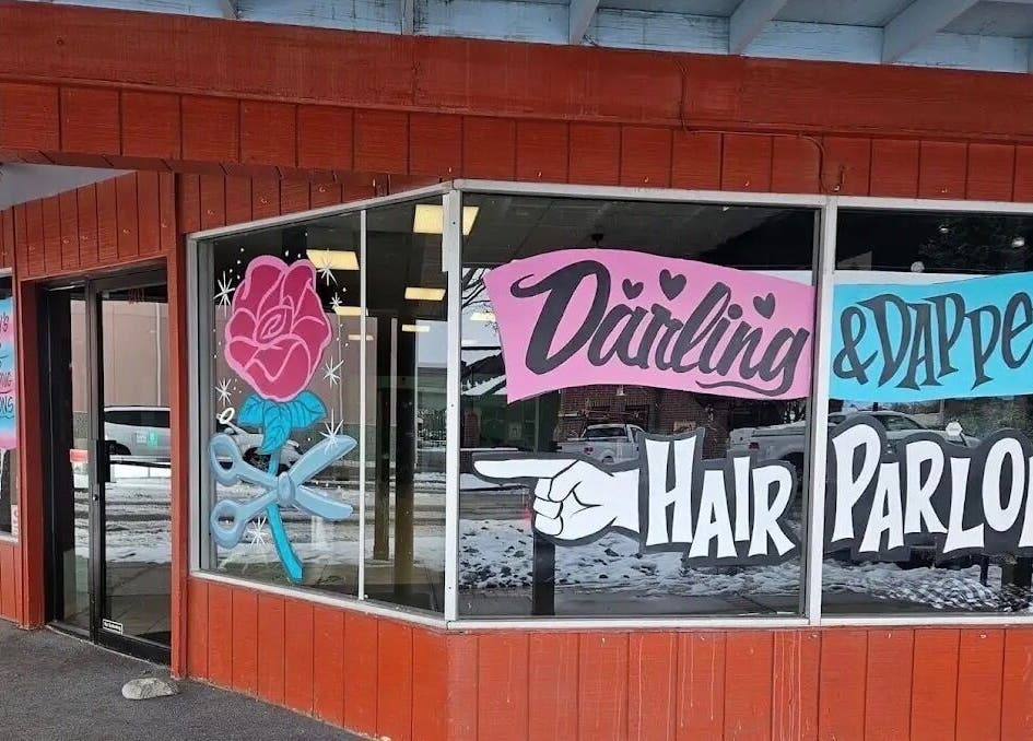 Tahnisha @ Darling & Dapper salon exterior in Fallon, Nevada, US with colorful window art and signage.