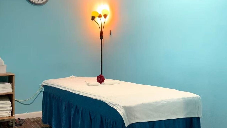 Tranquil massage room at Wellness Foot Spa in Glenside, Pennsylvania, US with cozy lighting.