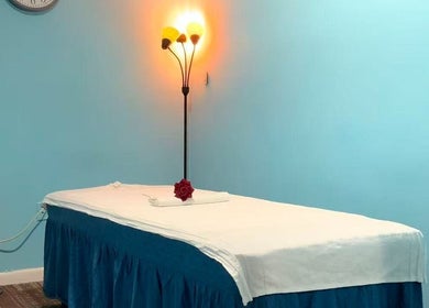 Tranquil massage room at Wellness Foot Spa in Glenside, Pennsylvania, US with cozy lighting.