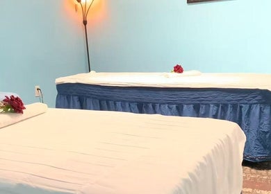 Serene treatment room at Wellness Foot Spa, Glenside, Pennsylvania, US, with relaxing beds and calming decor.