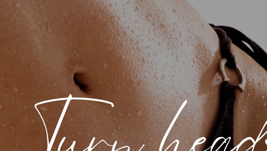 Smooth, toned body with water droplets, showcasing skincare treatment at Luxe Beautè Brows & Body Contouring, North Mackay.