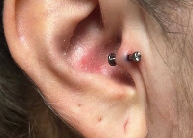 Close-up of a stud piercing at Kawaii Luxe Glow in Modesto, California, US, showcasing expert jewelry placement.