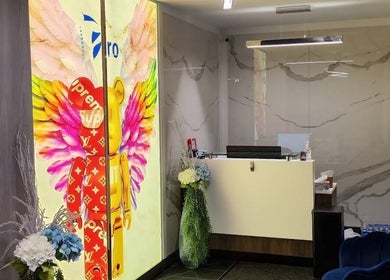 Bright reception area at Lumina Massage Wellness Center, Markham, Ontario, CA with colorful mural.