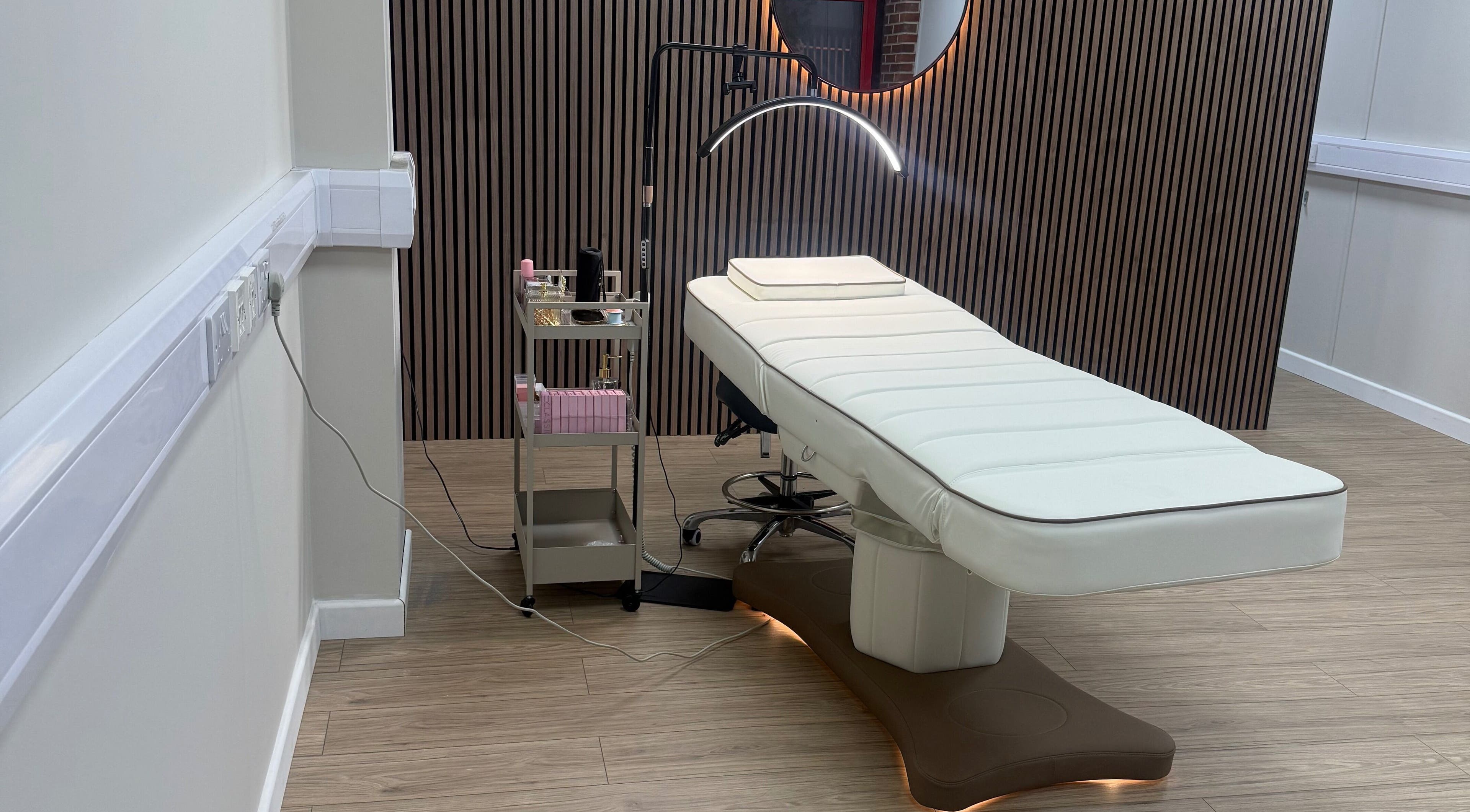 Relaxing treatment room at Studio No.9 in Scunthorpe, England, GB featuring a modern therapy bed.