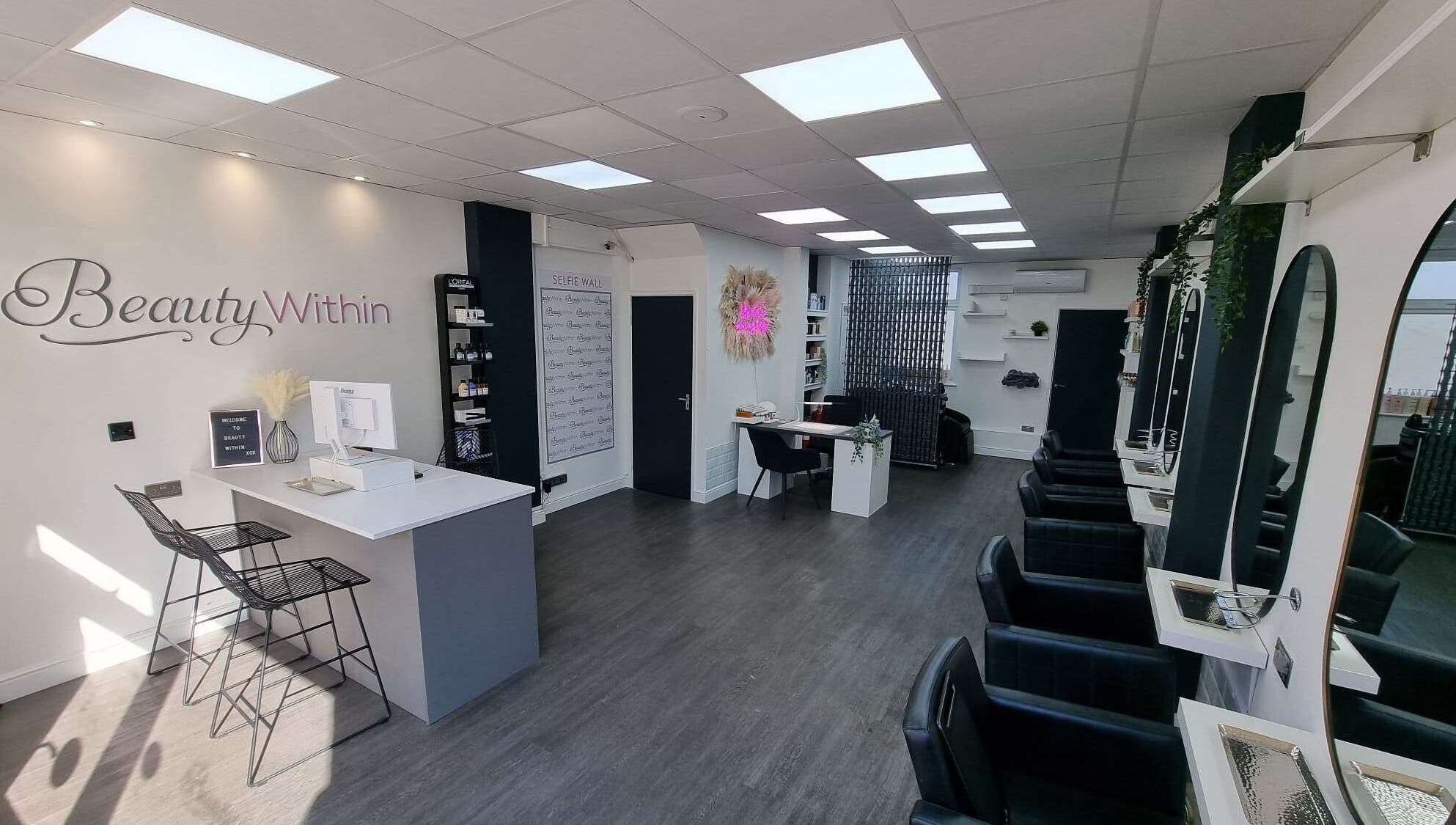 Modern interior of Knot Just Hair salon in Didcot, England, GB featuring sleek design and stylish chairs.