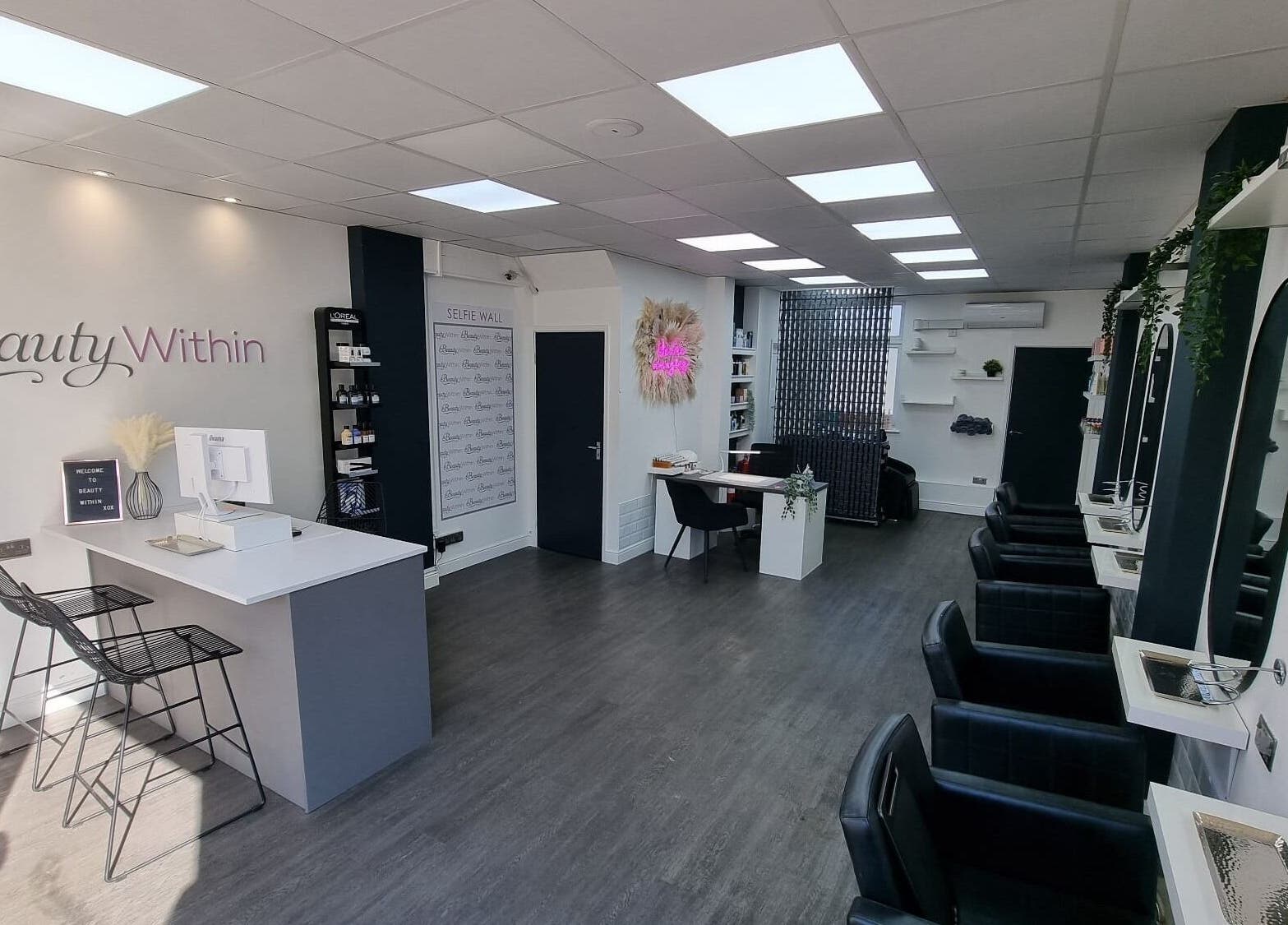 Modern interior of Knot Just Hair salon in Didcot, England, GB featuring sleek design and stylish chairs.