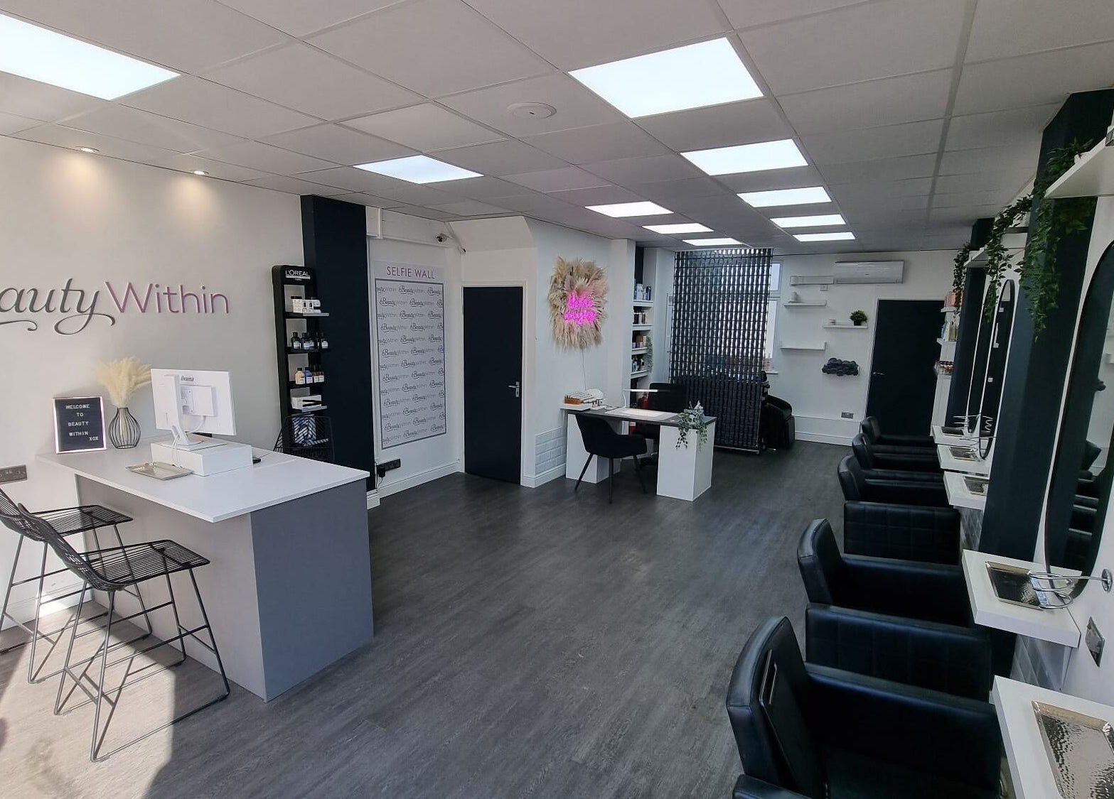 Modern interior of Knot Just Hair salon in Didcot, England, GB featuring sleek design and stylish chairs.