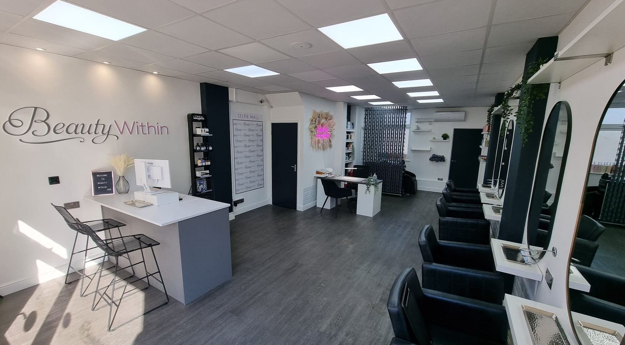 Modern interior of Knot Just Hair salon in Didcot, England, GB featuring sleek design and stylish chairs.