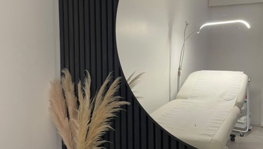 Calming treatment room at Beauty HQ, Southport, England, GB featuring a modern massage table and elegant decor.