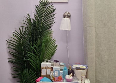 Relaxing spa setup at Massage Facial By Sasha Viki, Glasgow, Scotland, GB with skincare products and greenery.