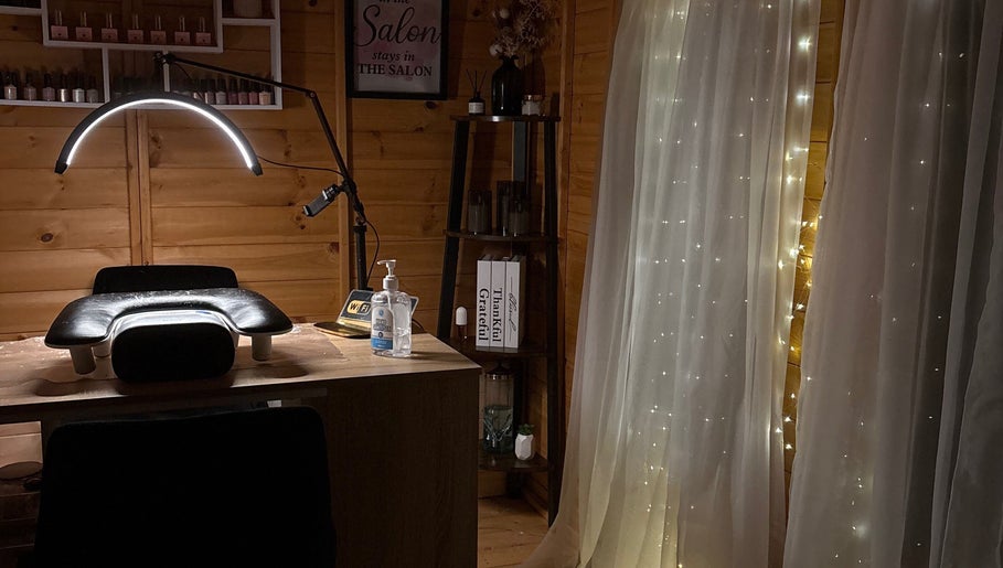 Inviting nail studio setup at Nails by Ella, Caerphilly, Wales, GB with ambient lighting and elegant decor.