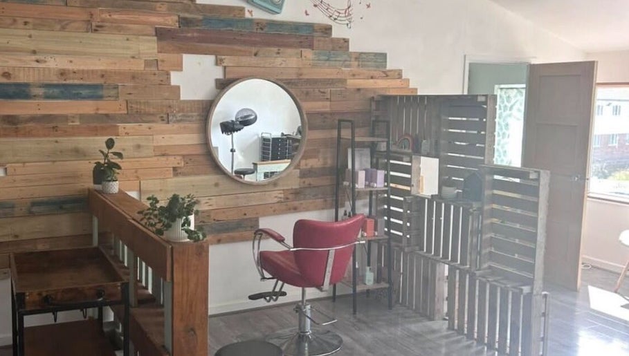 Cozy salon space at Tracey Jack Hair at Evolve, Newquay, England, GB with rustic decor and styling chair.