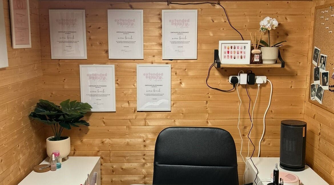 Chic interior of Nailed By Nina in Shirley, England, GB showcasing awards, decor, and workspace essentials.