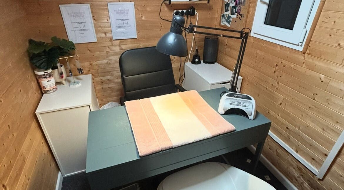 Nailed By Nina's chic workspace in Shirley, England, GB features a cozy nail treatment station.