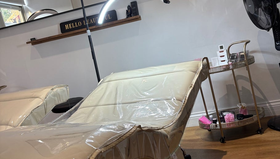 Luxury treatment chair at The Lash Palace, Shipley, England, GB with beauty tools on a cart.