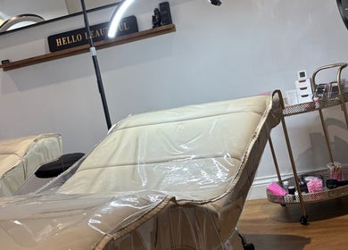Luxury treatment chair at The Lash Palace, Shipley, England, GB with beauty tools on a cart.